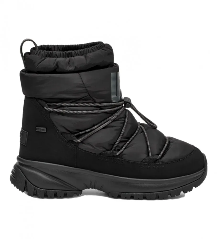 Botas W Yose Puffer Mid negro