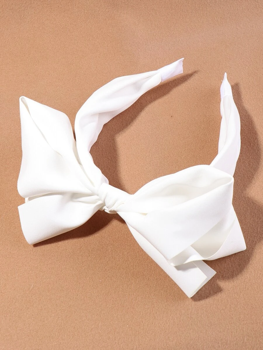 Diadema ancha con lazo blanco