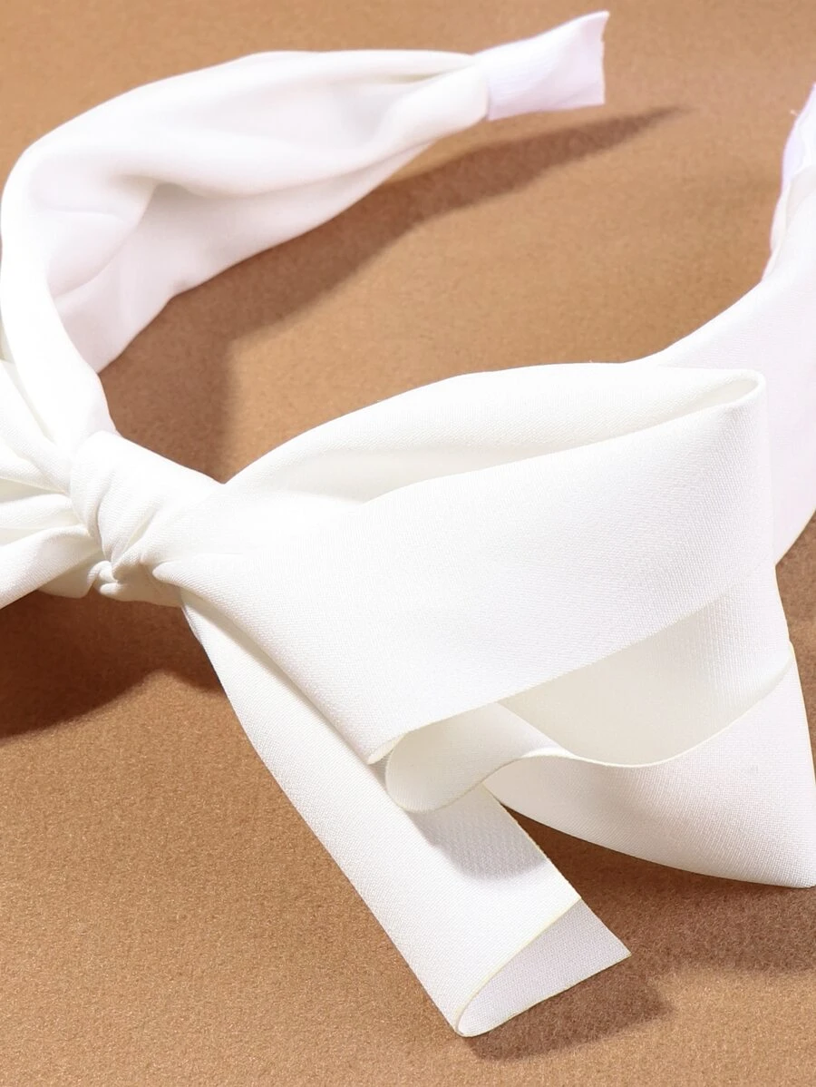 Diadema ancha con lazo blanco